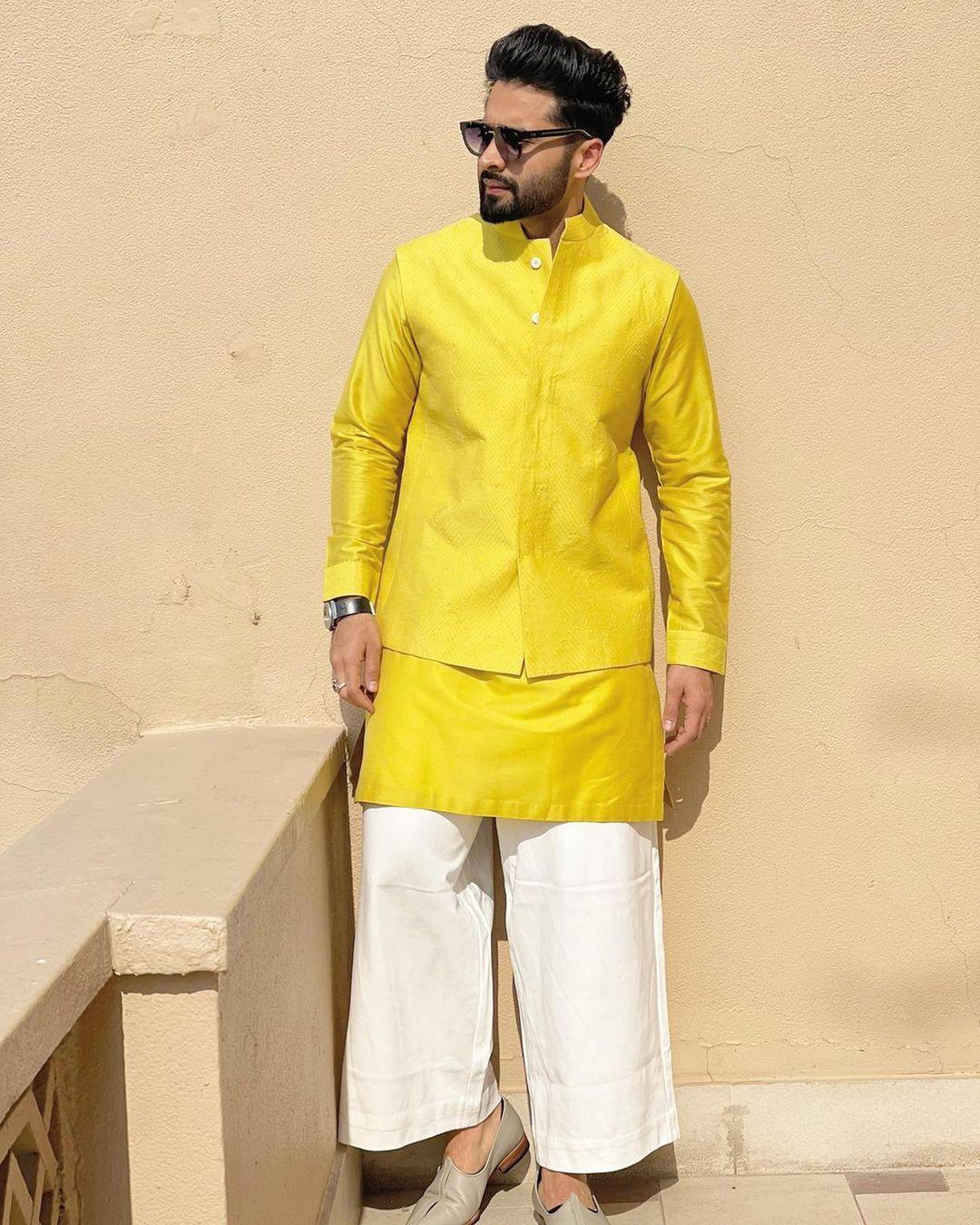 Jackky Bhagnani is currently in the spotlight for his upcoming wedding with actress Rakul Preet Singh. Beyond his acting prowess, he's catching attention for his impeccable traditional fashion sense. In a recent look, the groom-to-be donned a refreshing yellow kurta paired with a matching jacket and white pyjama