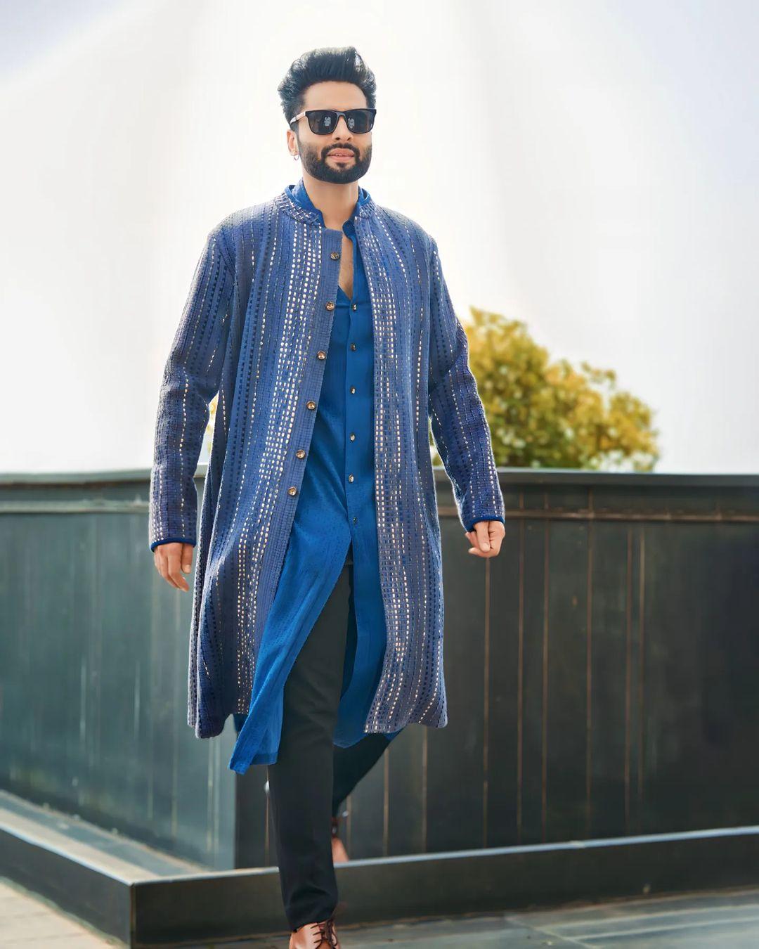 In a refreshing ensemble, Jackky opted for a blue kurta paired with a matching overcoat featuring shiny mirror work