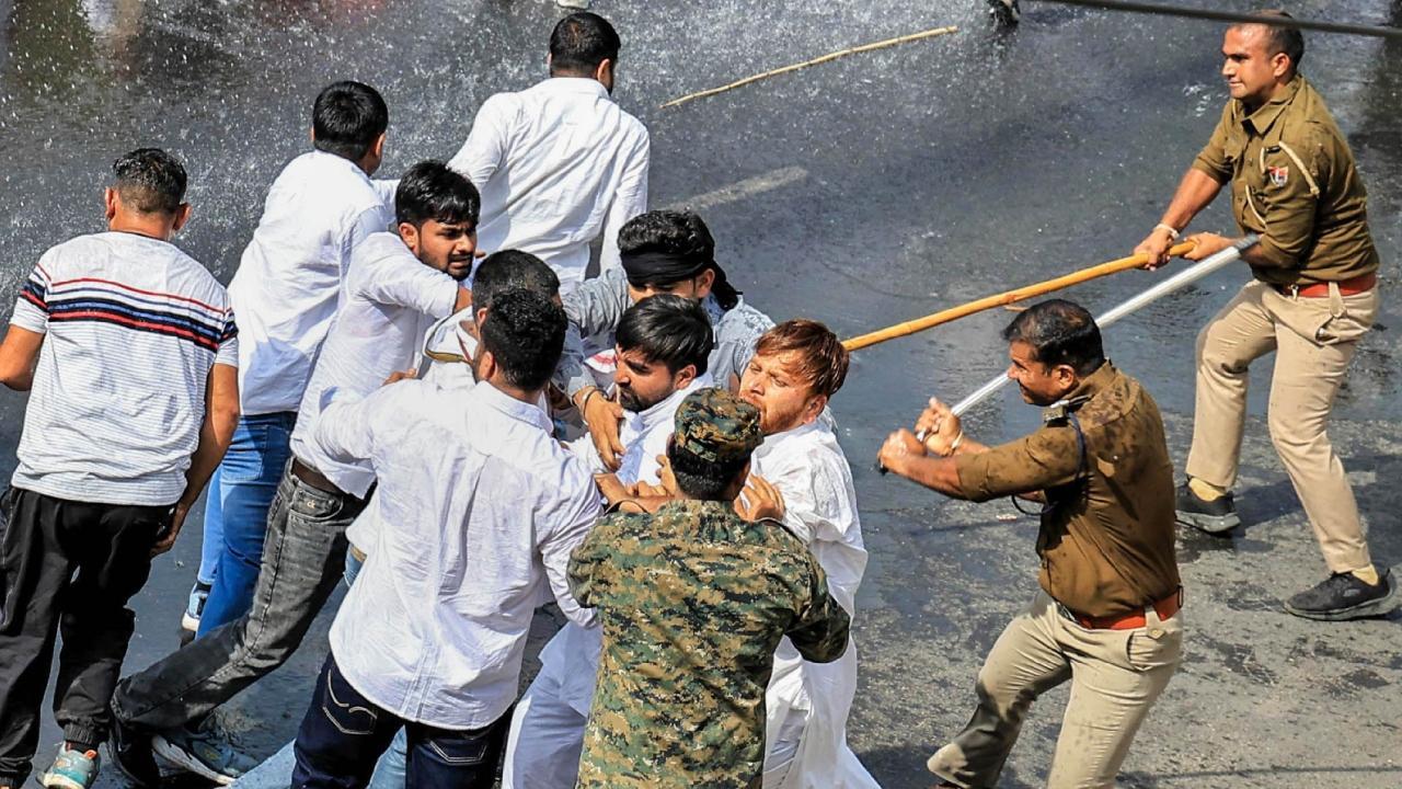 IN PHOTOS: Police use water cannon to disperse protesting Congress workers