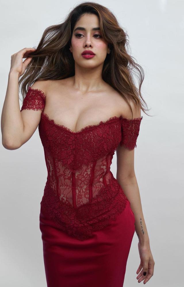 The stunning burgundy maxi dress steals the show with its captivating off-shoulder neckline and a lace corset