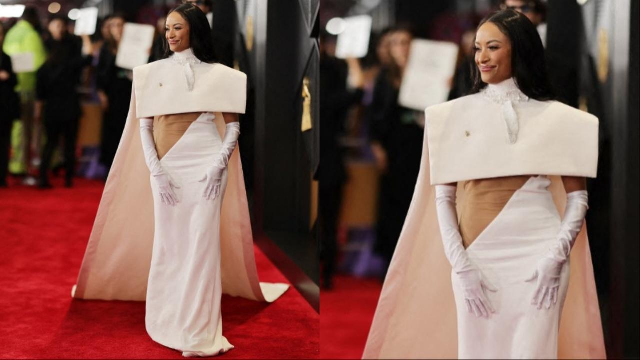 Actor and singer Kat Graham hit the red carpet in a cream-coloured dress with a structured cape. 