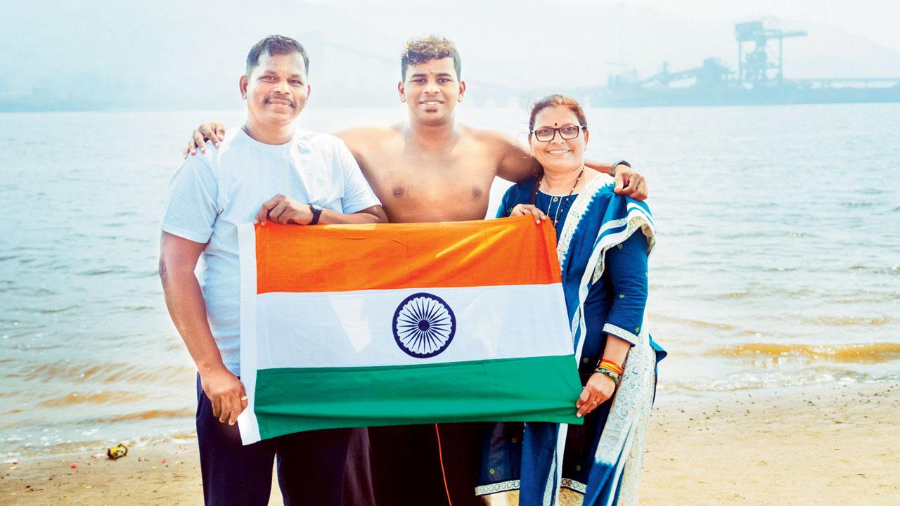 The swimmer poses at the finish line