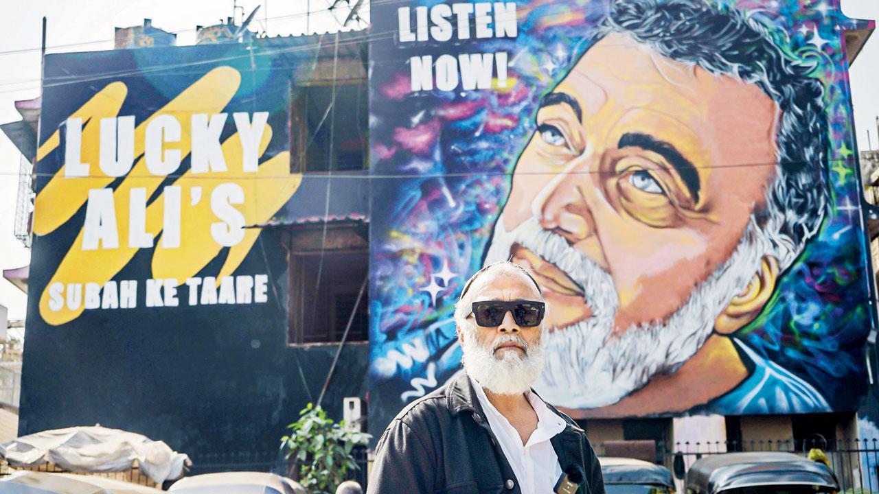 Lucky Ali poses with the mural painted across Chhatrapati Shivaji Maharaj International Airport