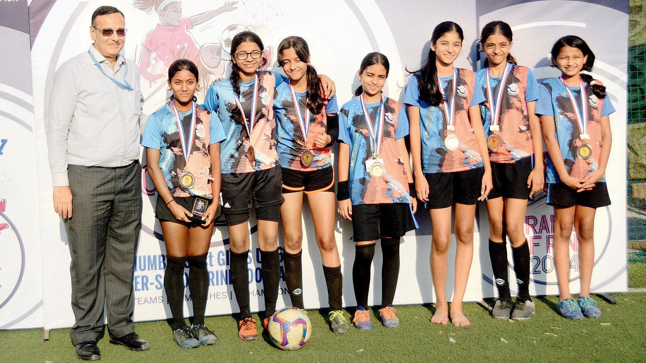 mid-day Ranis of Rink 2024 runners-up Rustomjee Cambridge (Dahisar) receive their trophy and medals from  Udayan Banerjee (seventh from left), Hon Treasurer of the Mumbai Football Association 