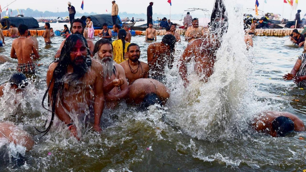 Devotees take a holy dip in the Ganga river on the occasion of ‘Mauni Amavasya’ during the annual religious 'Magh Mela' festival at Sangam in Prayagraj. Pics/PTI