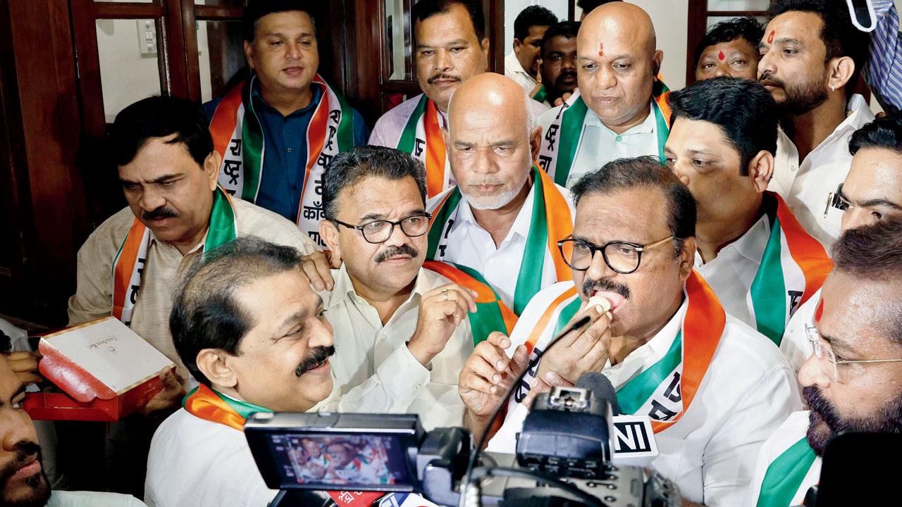 Nationalist Congress Party workers of the Ajit Pawar faction celebrating at the NCP office the group operates from in Churchgate, on Tuesday