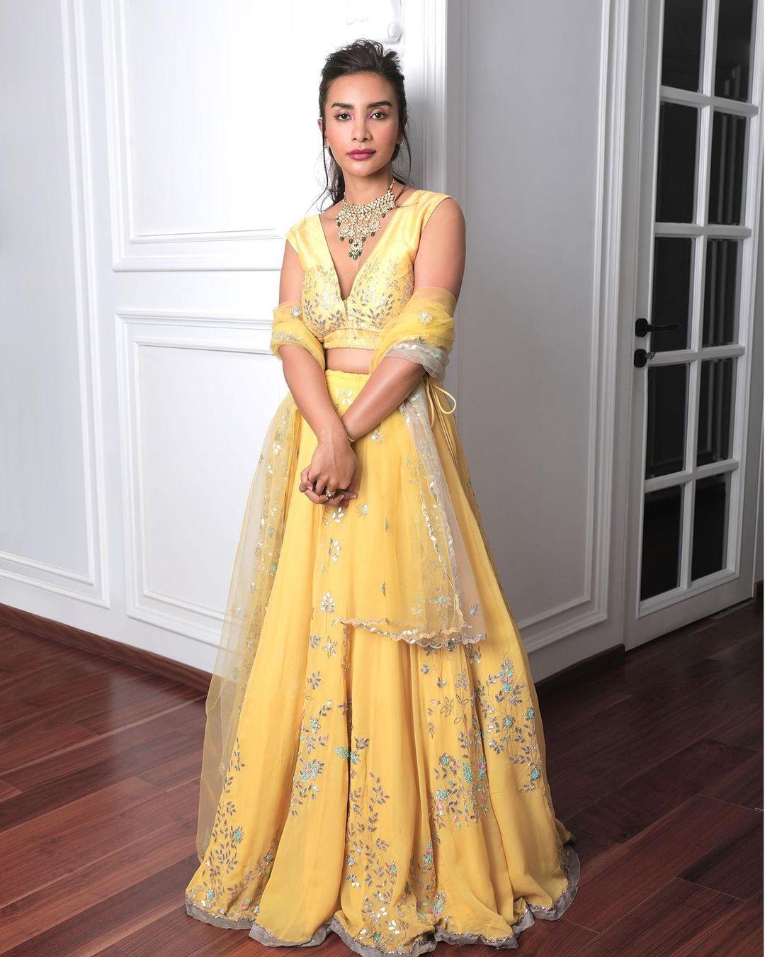 It looks like Patralekhaa loves yellow a little more than any other colour. In this yet another stunning appearance, the actress paired a beautiful yellow lehenga with a matching deep-neck blouse and sheer dupatta