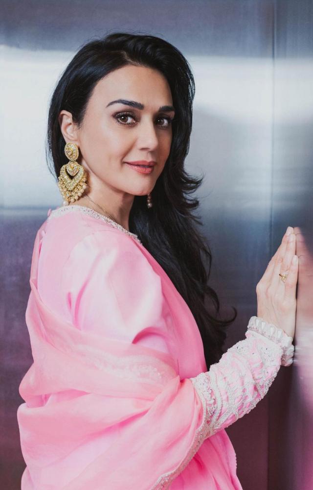 preity zinta pink dress Celebrating love! Preity Zinta in a Gauri & Nainika candy pink plumetis tulle off-shoulder corseted midi. Explore our plumetis collection