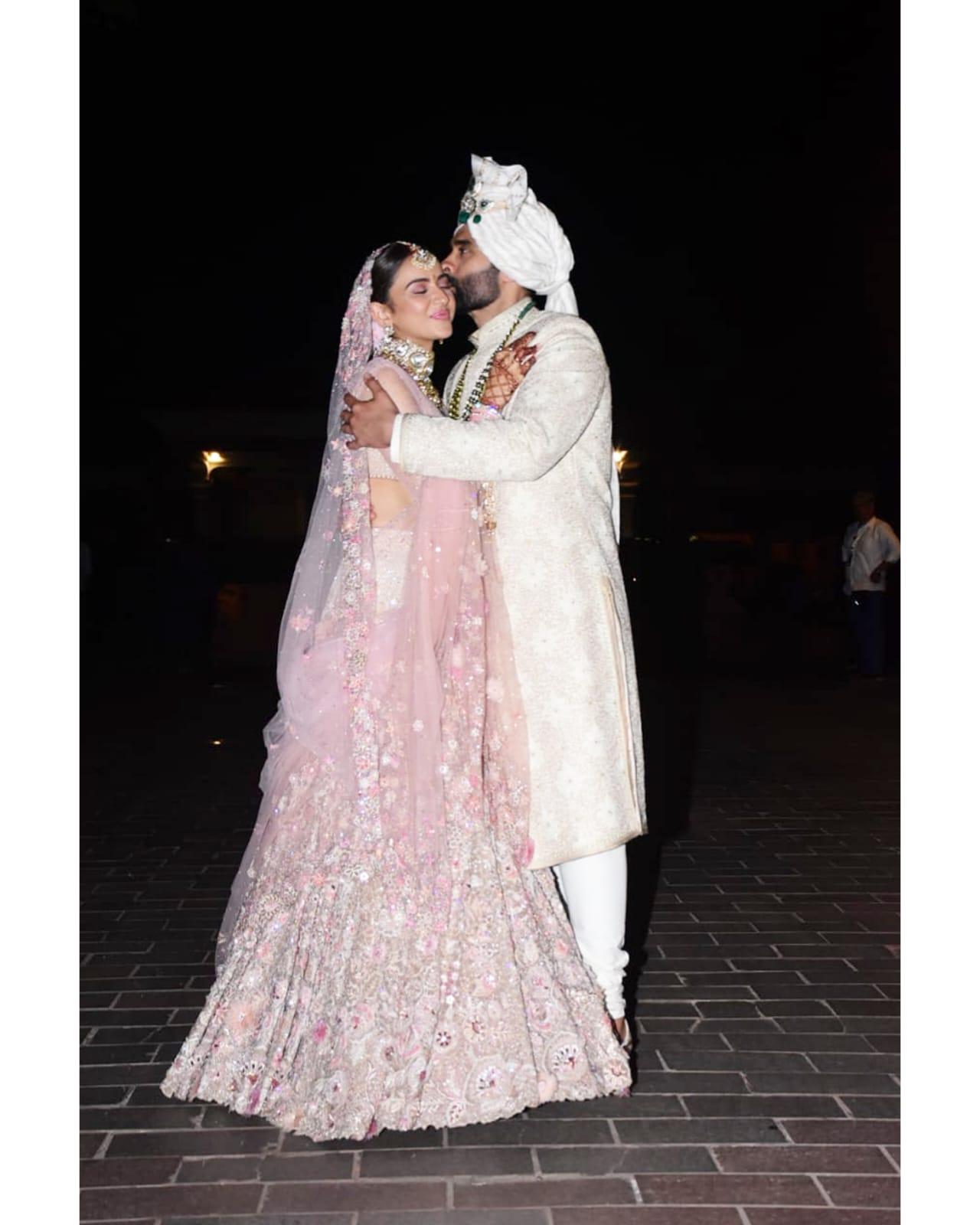 As the newlywed couple posed for the camera, Jackky Bhagnani planted a kiss on Rakul's forehead and it is all things love