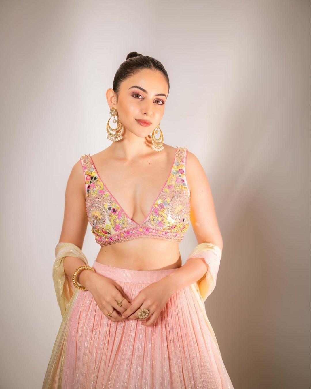 Rakul's pastel lehenga look is undeniably a must-have for those who aspire to radiate grace and charm at any special occasion