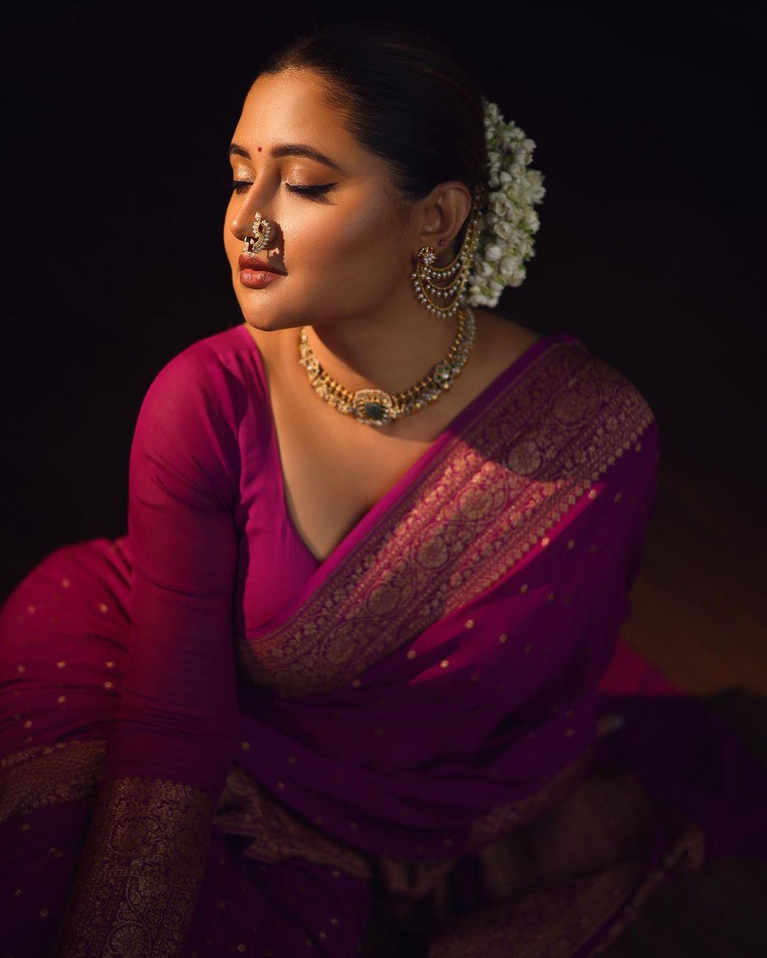 The sharp contouring and shiny makeup add glamour to the overall look, making it suitable for any special occasion