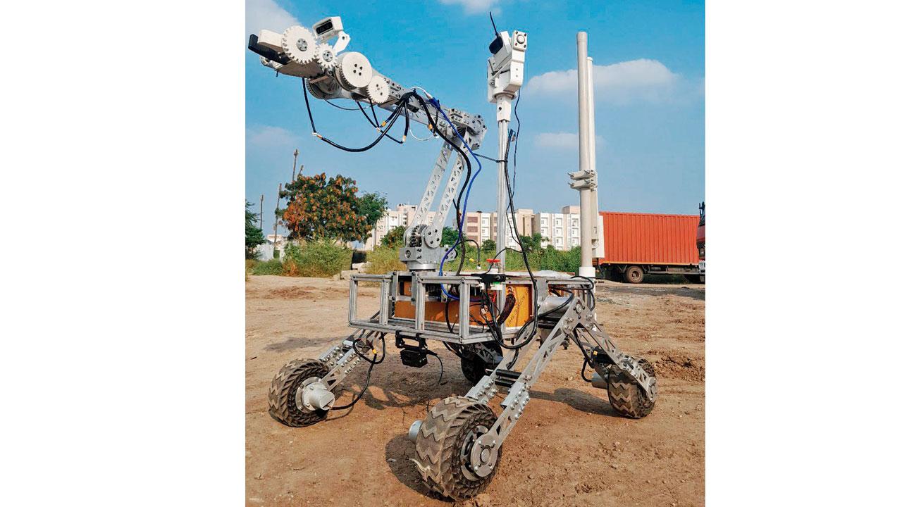 The rover (above) and the drone made by the team traversed a makeshift Mars terrain in Coimbatore