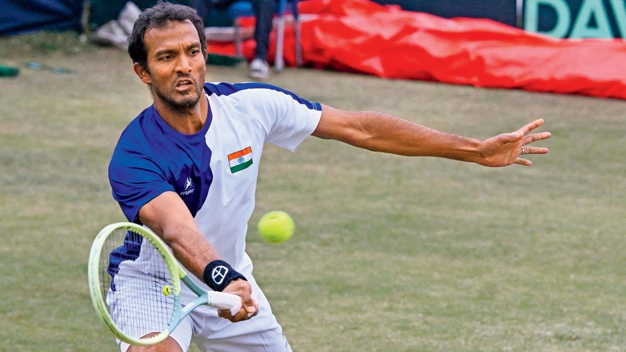 India’s Sriram Balaji  during his match against Pakistan’s Aqeel Khan. Pic/AFP