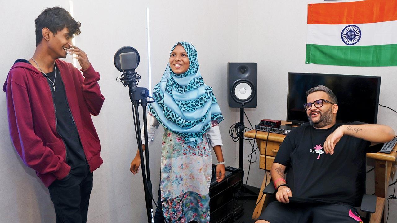 (From left) Ayush and Saniya with Hashbass at the school studio