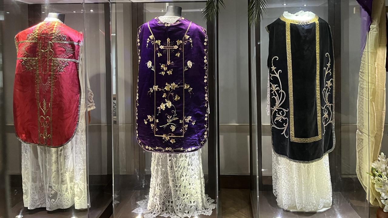 VestmentsAdorning the display are vestments (garments associated with the clergy and religious) in colours associated with the season of Lent. Dating back to the nineteenth and twentieth centuries, they also feature images of the Crucifixion through some exemplary embroidery