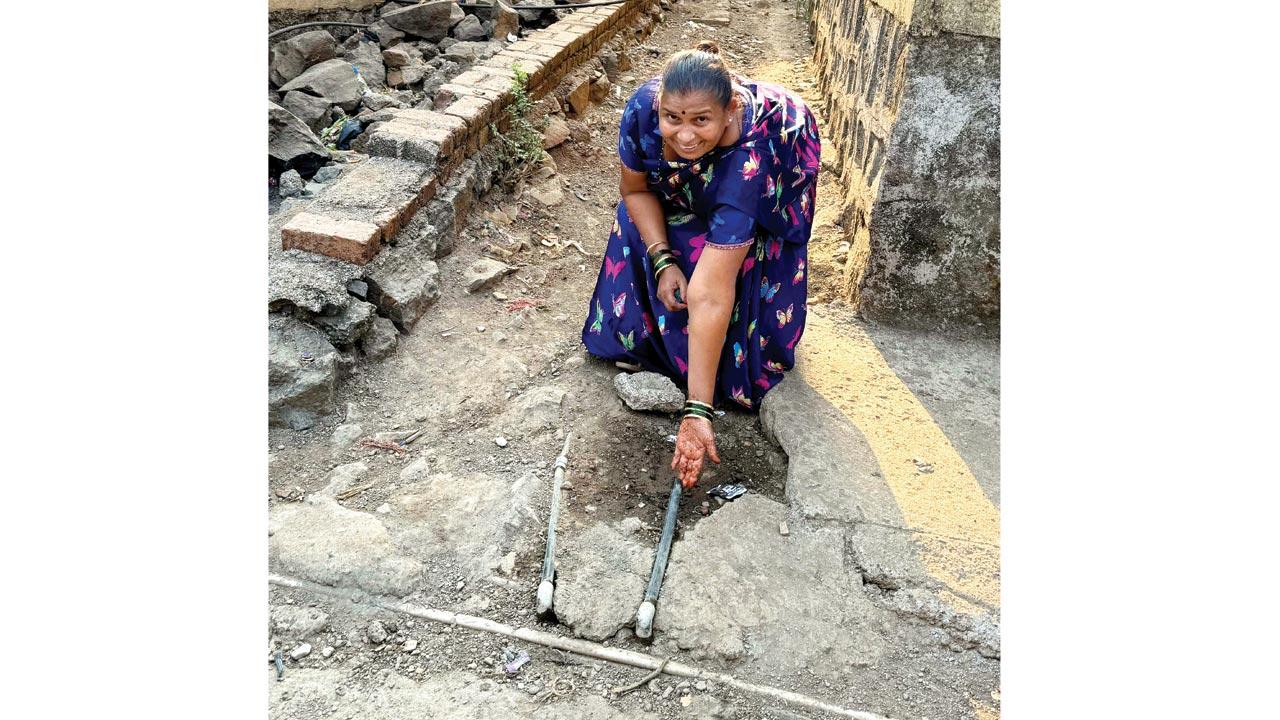 A resident showing the pipelines without a tap