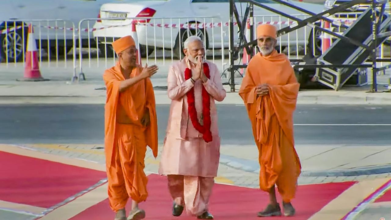 PM Modi was welcomed by BAPS' Ishwarcharandas Swami and garlanded by a group of priests upon his arrival. People gathered for the occasion also raised slogans and he waved towards them