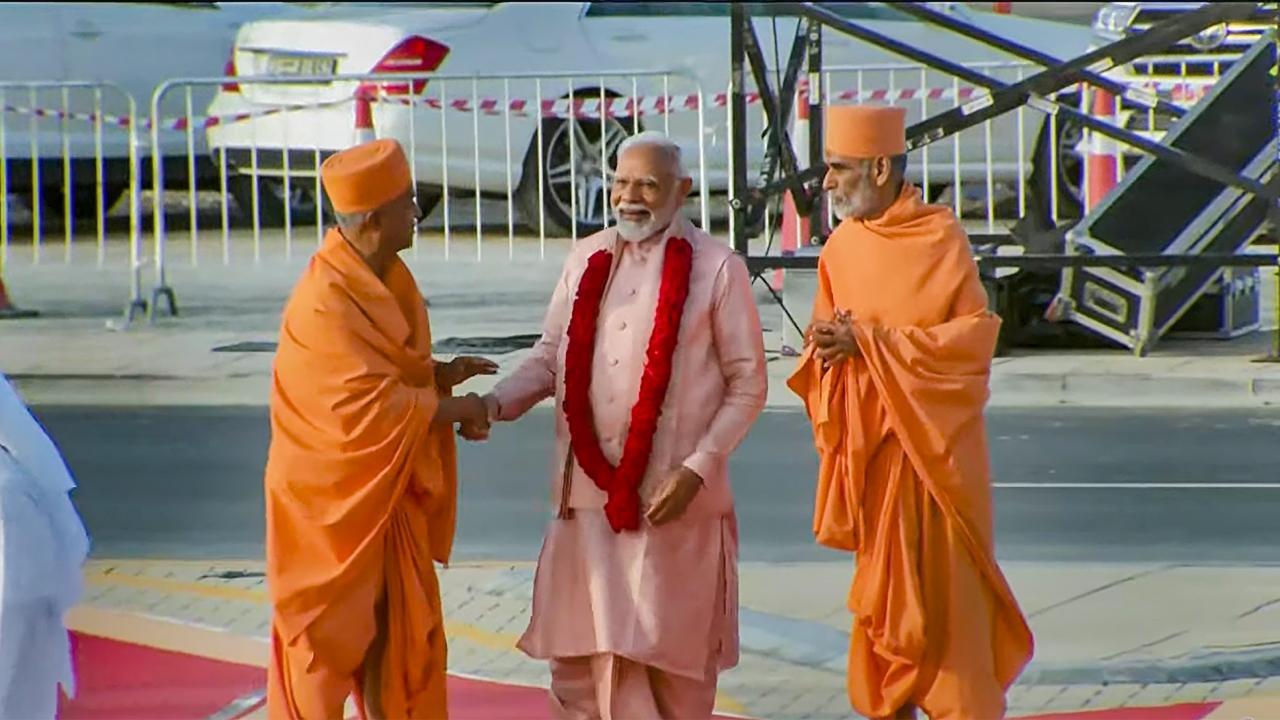 PM Modi, upon his arrival at the temple, met people from different faiths who contributed in construction of first Hindu stone temple in Abu Dhabi. Pics/PTI and AFP