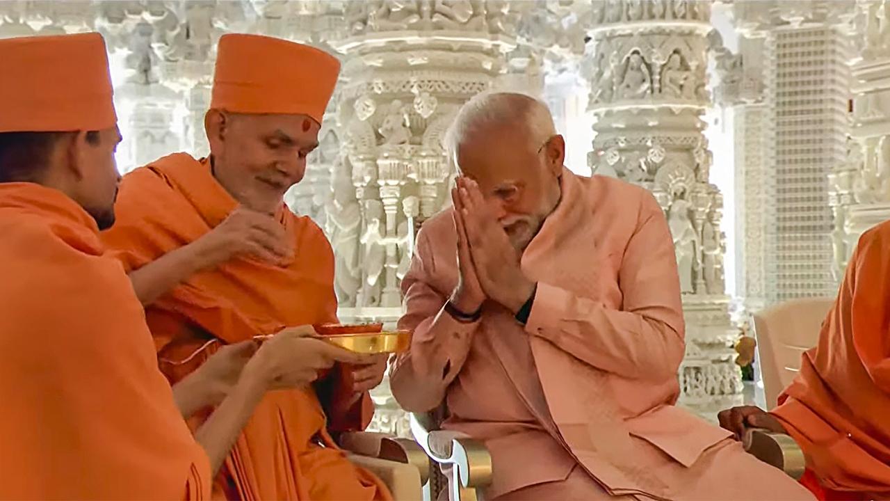 Dressed in a light pink silk dhoti and kurta paired with a sleeveless jacket and stole, the prime minister participated in rituals of a ceremony to dedicate the temple to the people