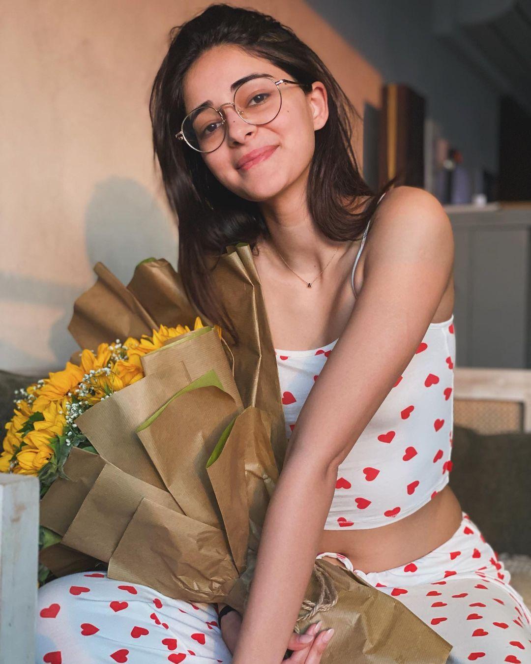 Ananya Pandey posted this picture of herself holding a bouquet saying, 