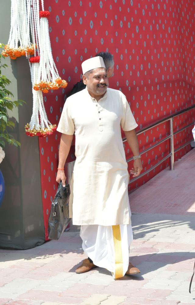 Pandit arrives to conduct ceremonies at the pre-wedding celebrations