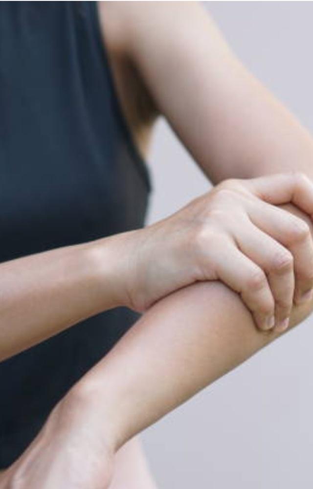 Muscle weakness, resulting in difficulty sitting, standing up, and raising arms overhead 
