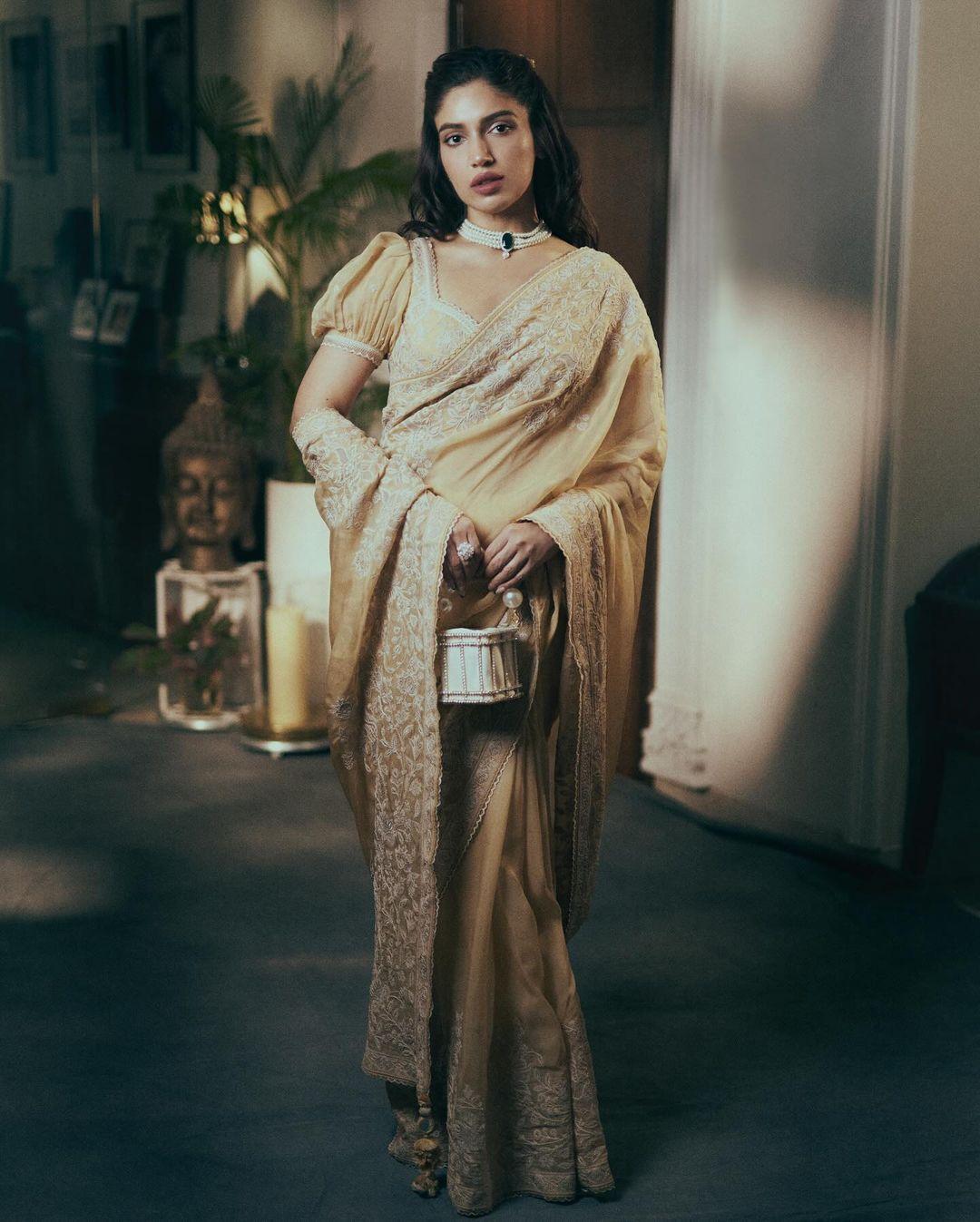 Bhumi Pednekar channelled her inner diva in this stunning look. The actress wore a heavy saree with decorated broad borders and paired it with a stylish blouse