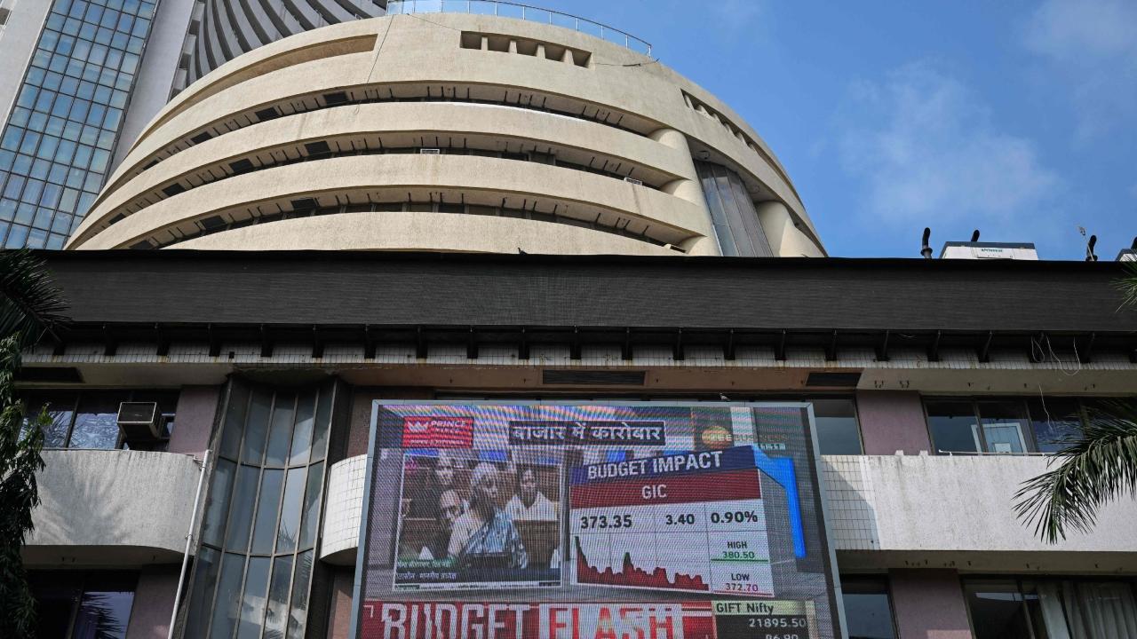 A digital screen displays a broadcast of the budget speech by Indian Finance Minister Nirmala Sitharaman on the facade of the Bombay Stock Exchange (BSE) in Mumbai. Pics/AFP and PTI