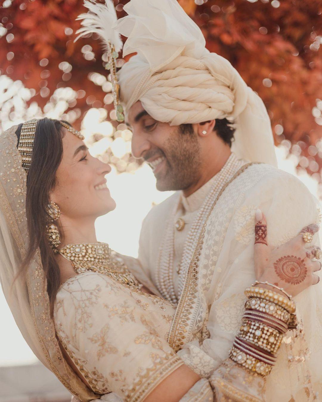 Alia Bhatt shared several pictures on her wedding day, but one moment stood out as particularly amusing and candid. In the photo, Alia is all smiles and can't control her laughter as her husband holds her in his arms. Ranbir Kapoor, meanwhile, appears to be feeling shy but is also smiling.