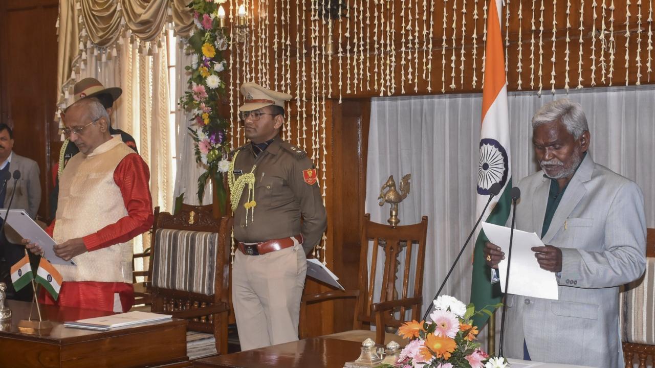 Jharkhand Governor CP Radhakrishnan administers the oath of office to JMM leader Champai Soren as the state CM during the swearing-in ceremony at Raj Bhawan in Ranchi. Pics/PTI