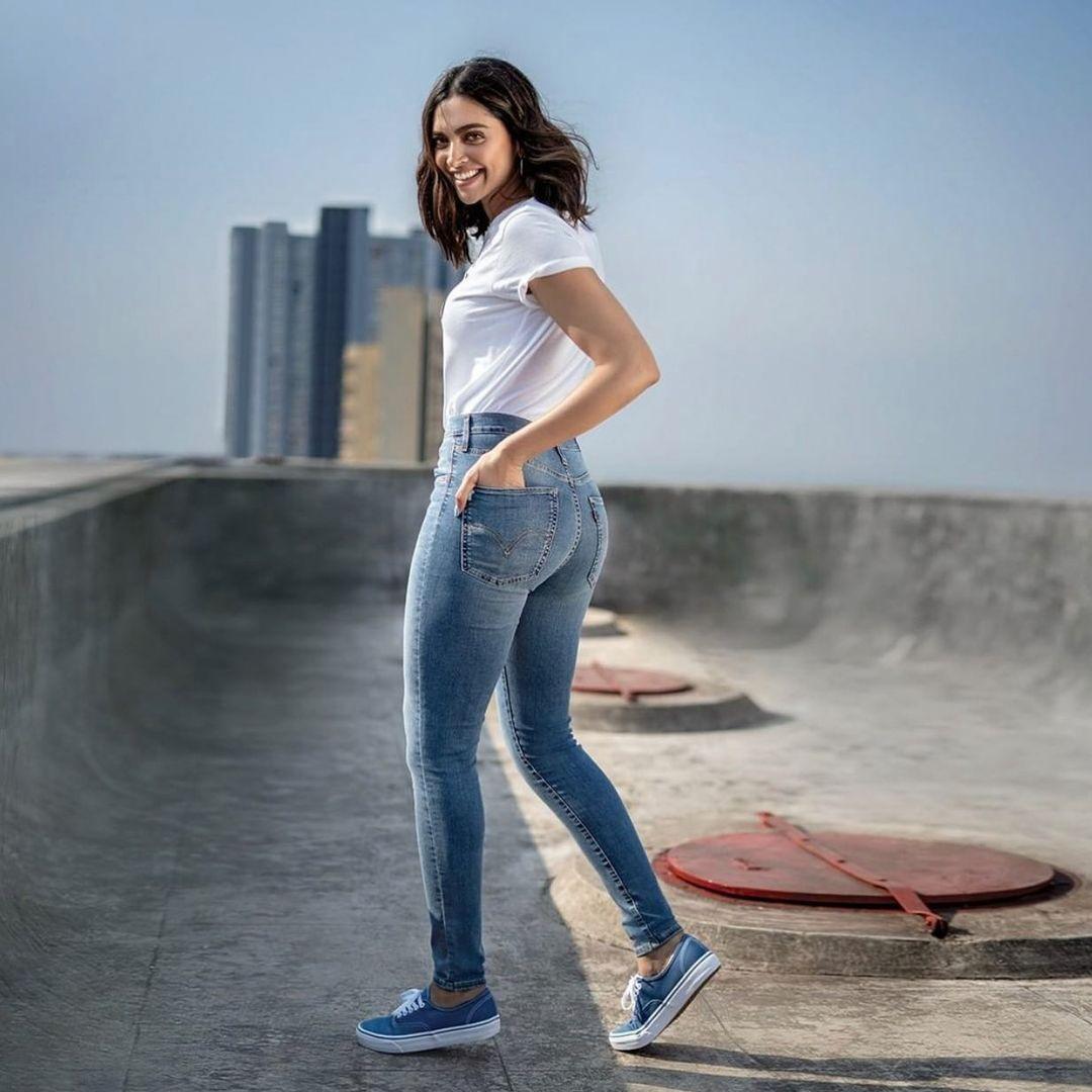 Deepika Padukone stuns in a laid-back summer ensemble, sporting simple blue jeans paired with a timeless white top – the ideal choice for a day out in the sun.