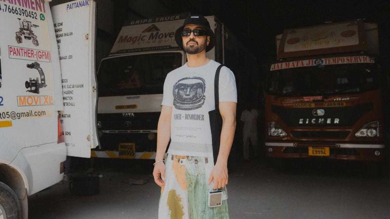 Diljit can be seen posing candidly in what appears to be the backstage area of a studio