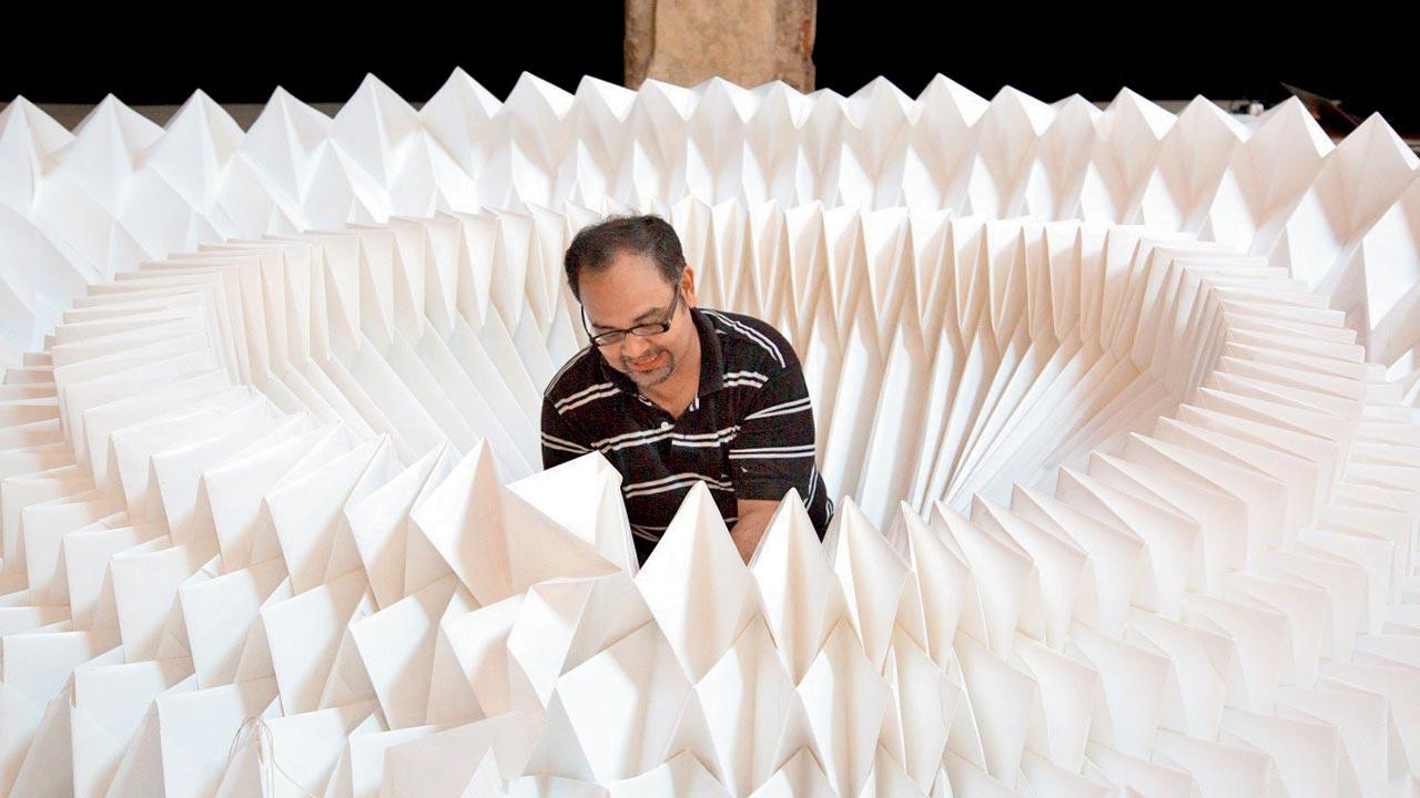 Ankon Mitra with a paper installation 
