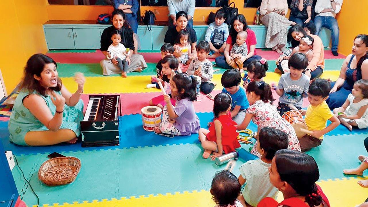 Children experiment with instruments at a previous session 