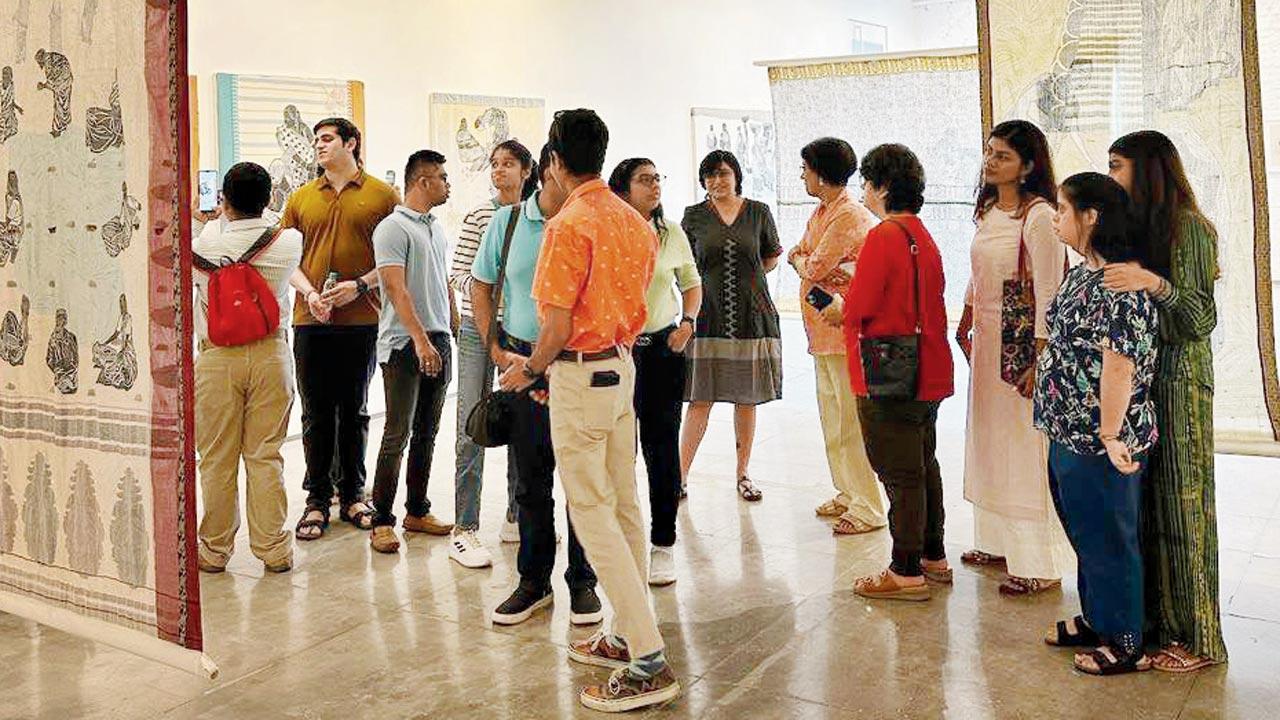 Learners from the community closely observe the exhibits at the gallery 