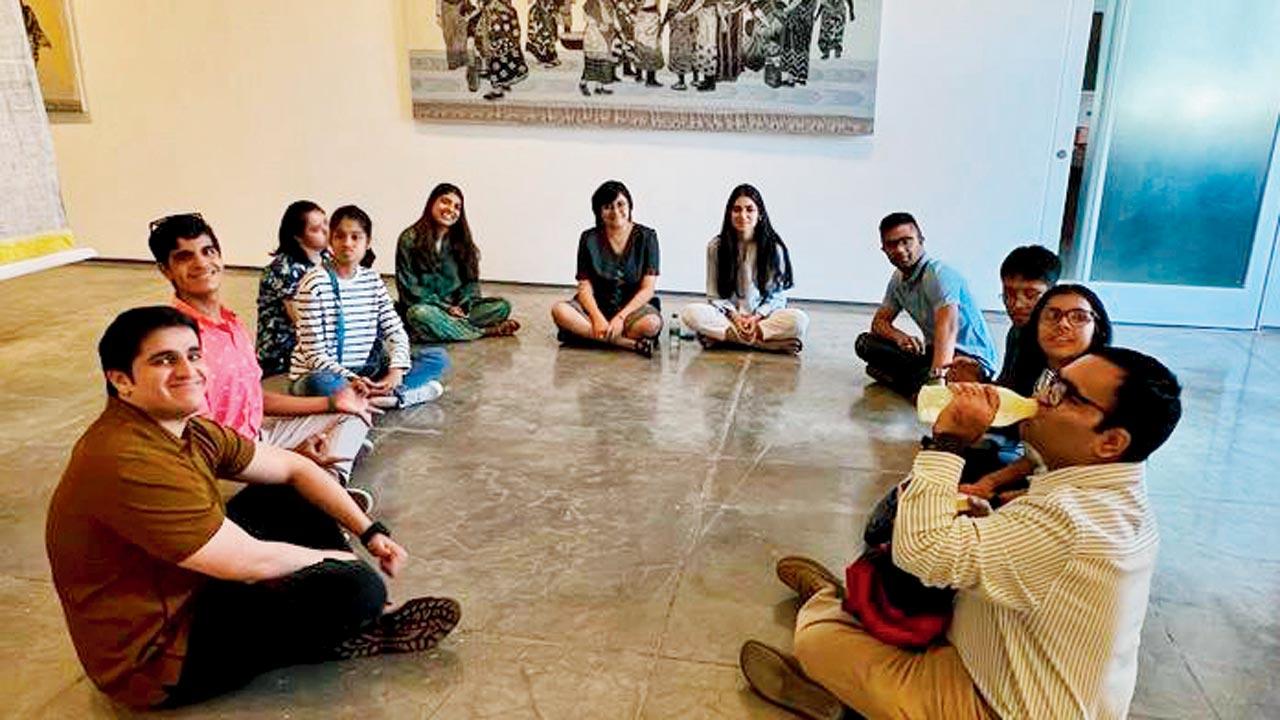 The team sits down for a group discussion at the exhibition 