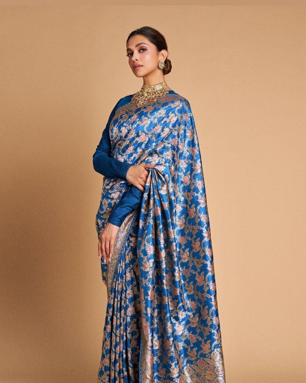 Sabyasachi handpicked this stunning peacock blue Benarasi saree for the queen as she stepped out in the city for a function honouring the Mumbai police