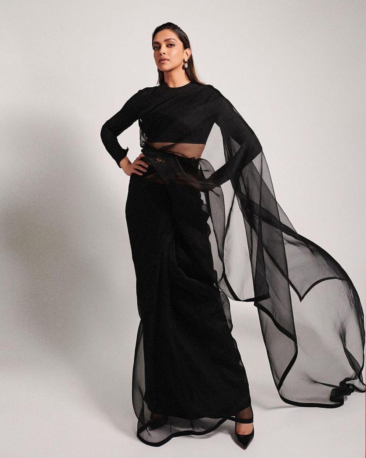 Deepika knows how to leave you awestruck with the simplest of saree looks. She opted for this black sheer net saree for a media interaction where she spoke about her career in the movies