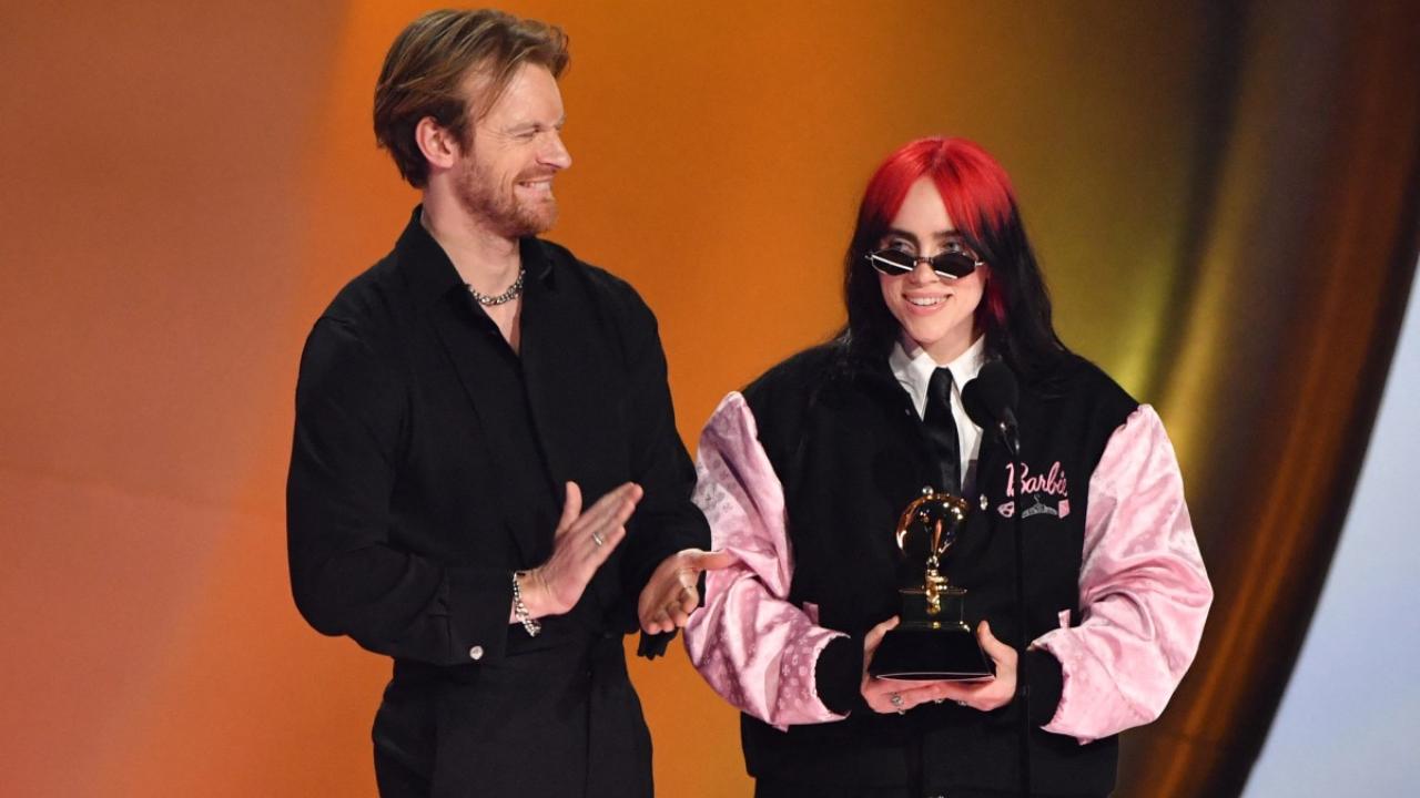 US singer-songwriter Billie Eilish (R) and US singer-songwriter Finneas O'Connell accept the Song Of The Year award for 