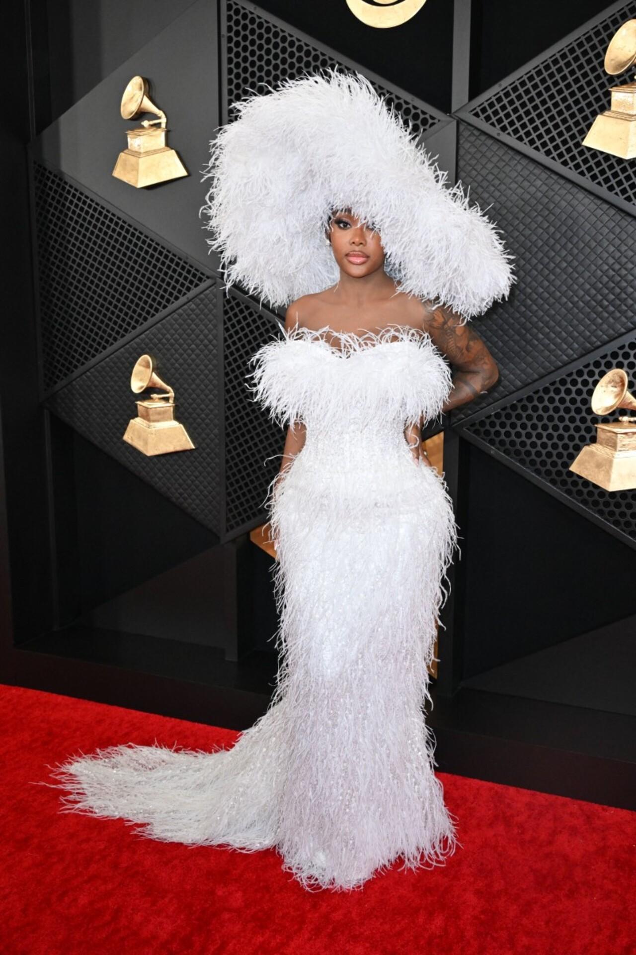 Summer Walker stood out in this white feather dress with a matching headgear