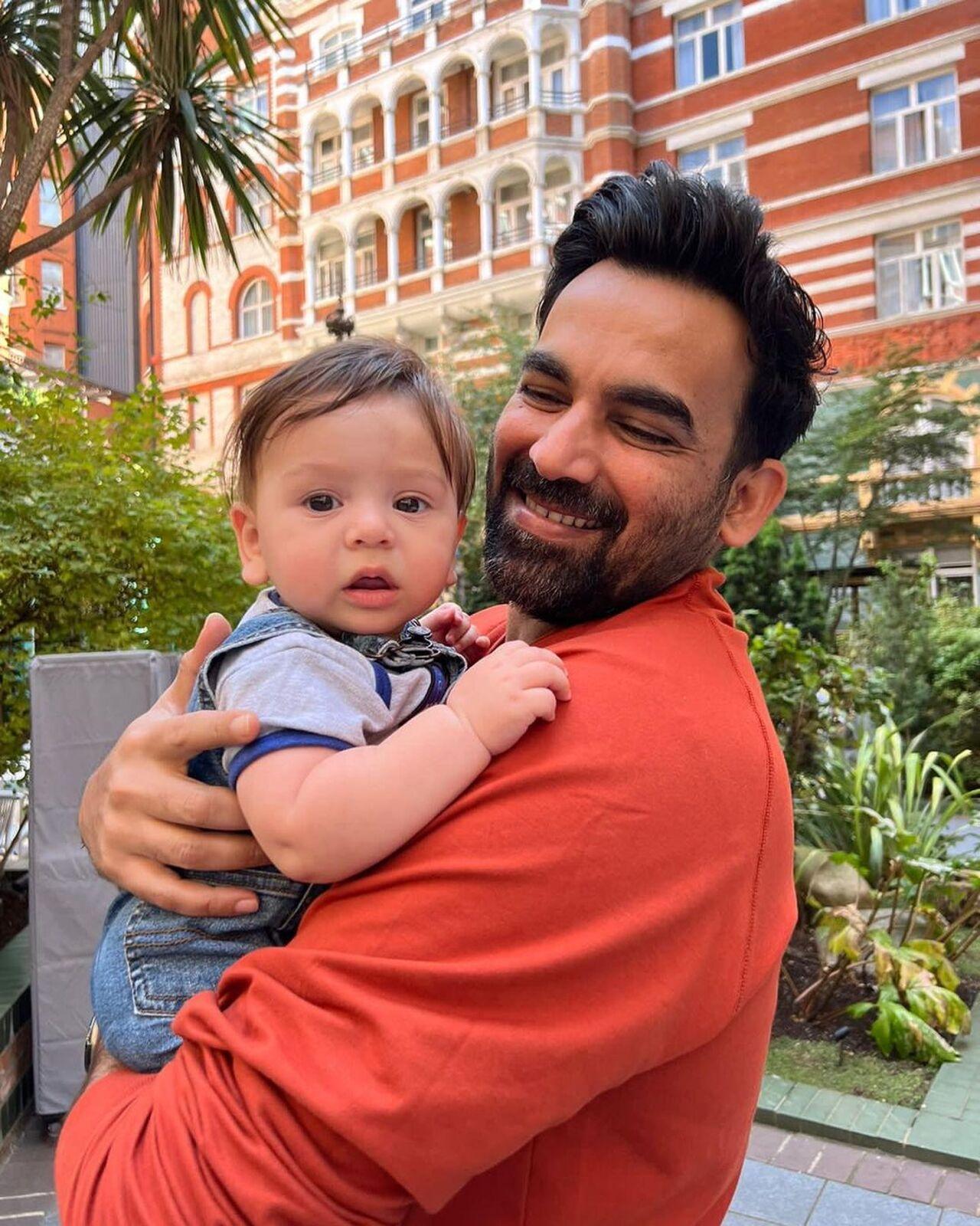 Yuvraj and Hazel's little munchkin poses with chachu Zaheer Khan 