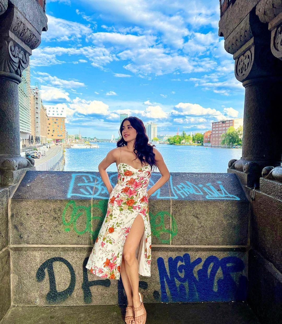 Janhvi Kapoor nails the perfect outfit for Propose Day in a stylish floral dress. The strappy dress complements her figure perfectly, tailored to fit and featuring a side slit that adds a touch of romance suitable for a European summer getaway.