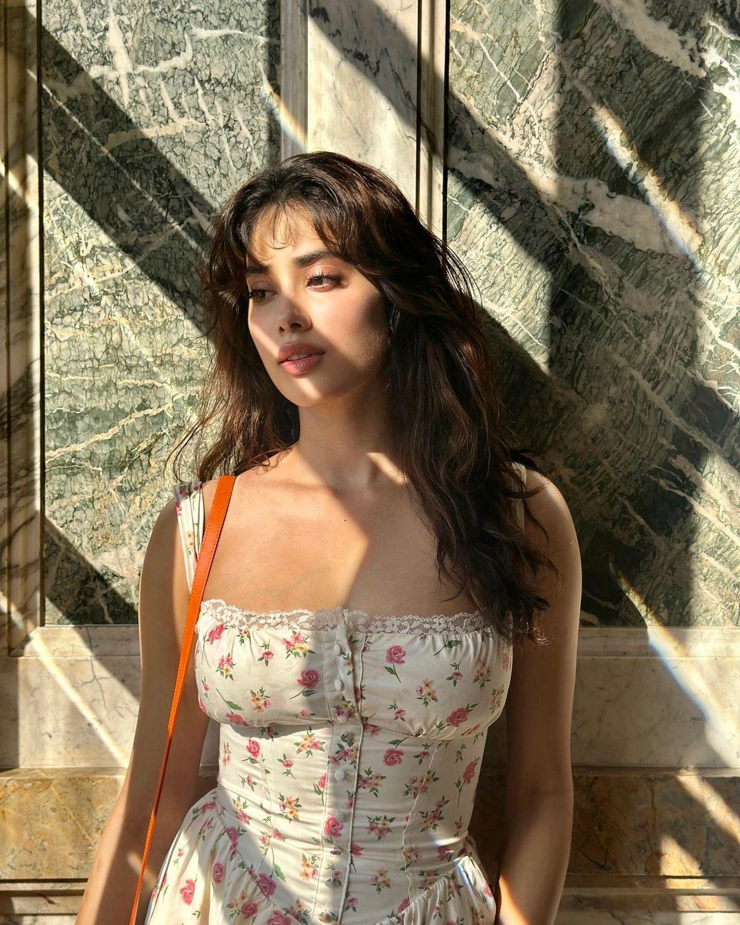 Janhvi Kapoor's choice of a floral outfit is ideal for a romantic proposal. The strappy maxi dress featured a corseted bodice and a flowy bottom, paired effortlessly with nude loafers. 