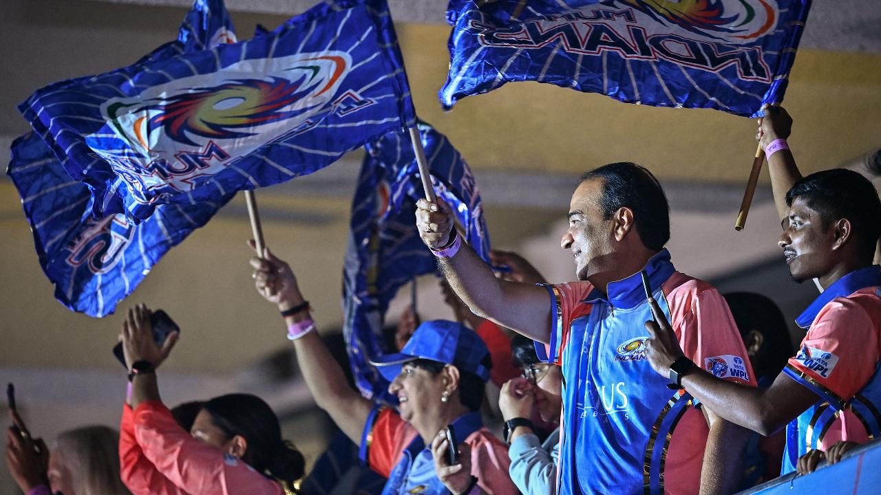 Mumbai Indians fans cheer during the opening ceremony of 2024 Women's Premier League (WPL) before the start of first Twenty20 cricket match between Mumbai Indians and Delhi Capitals