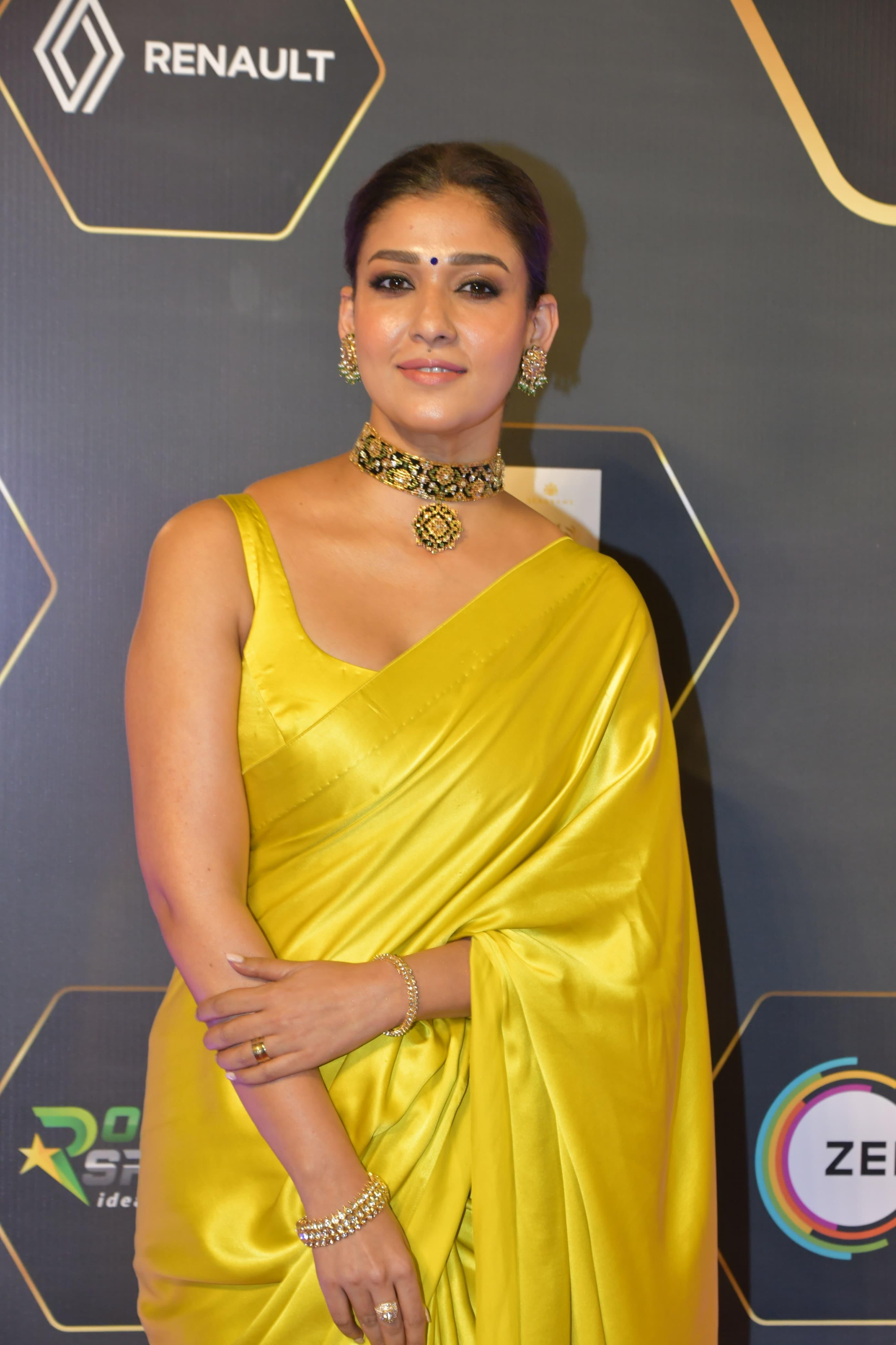 Actress Nayanthara stunned in a lemon yellow saree at the awards show. She won the Best Actress award for her role in Jawan.