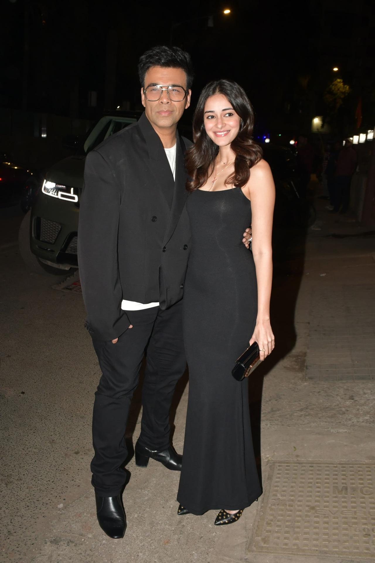 Karan Johar and Ananya Panday twin in black and pose together for the paparazzi