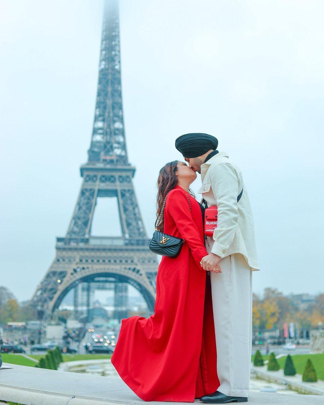 Neha Kakkar and her boyfriend took a romantic trip to Paris. She shared a sweet photo of them kissing. She wrote, 