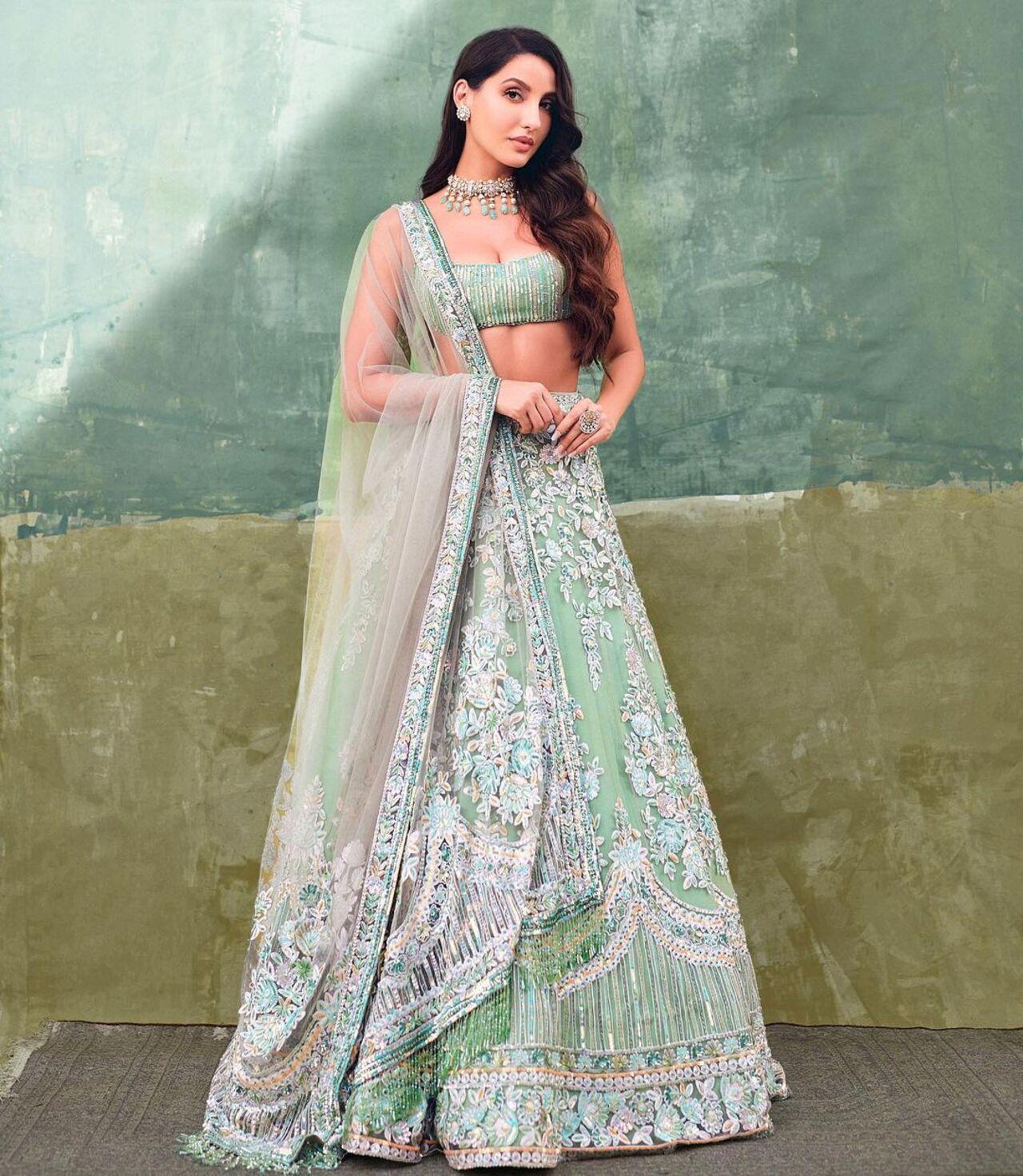 Pastel lehengas are in trend and this green lehenga with heavy embroidery is the perfect wedding look for the season