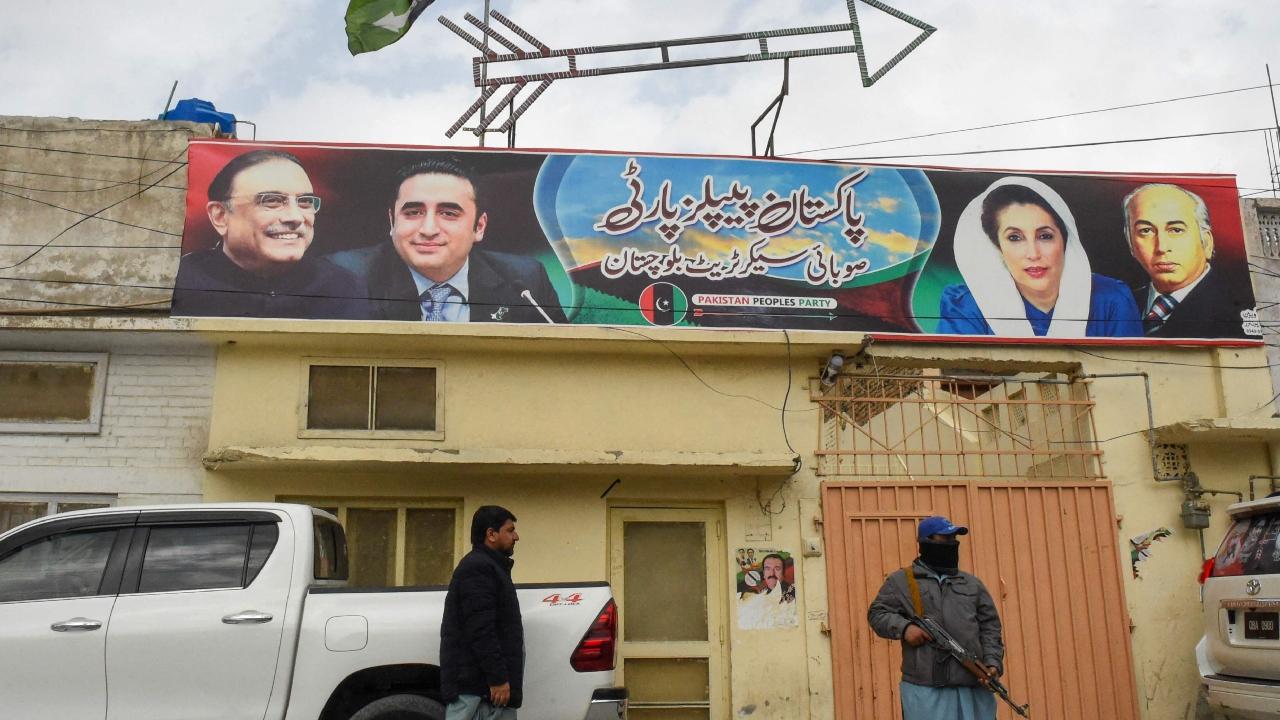 A security personnel stands guard near Pakistan Peoples Party (PPP) election office in Quetta. In the past few days, a dozen separate attacks have been reported across Balochistan, at least five of which targeted candidates from different political parties