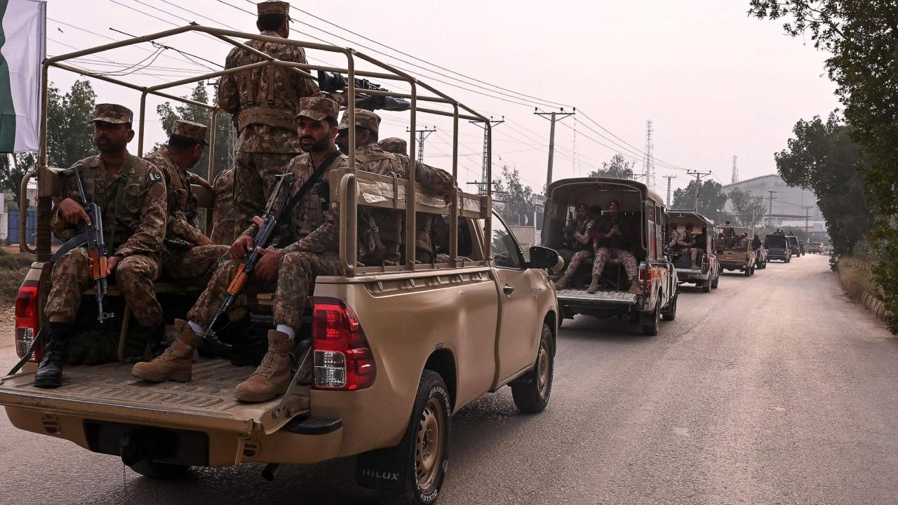A Pakistan army convoy patrols along a road in Hyderabad on February 6, ahead of Pakistan's national election on February 8
